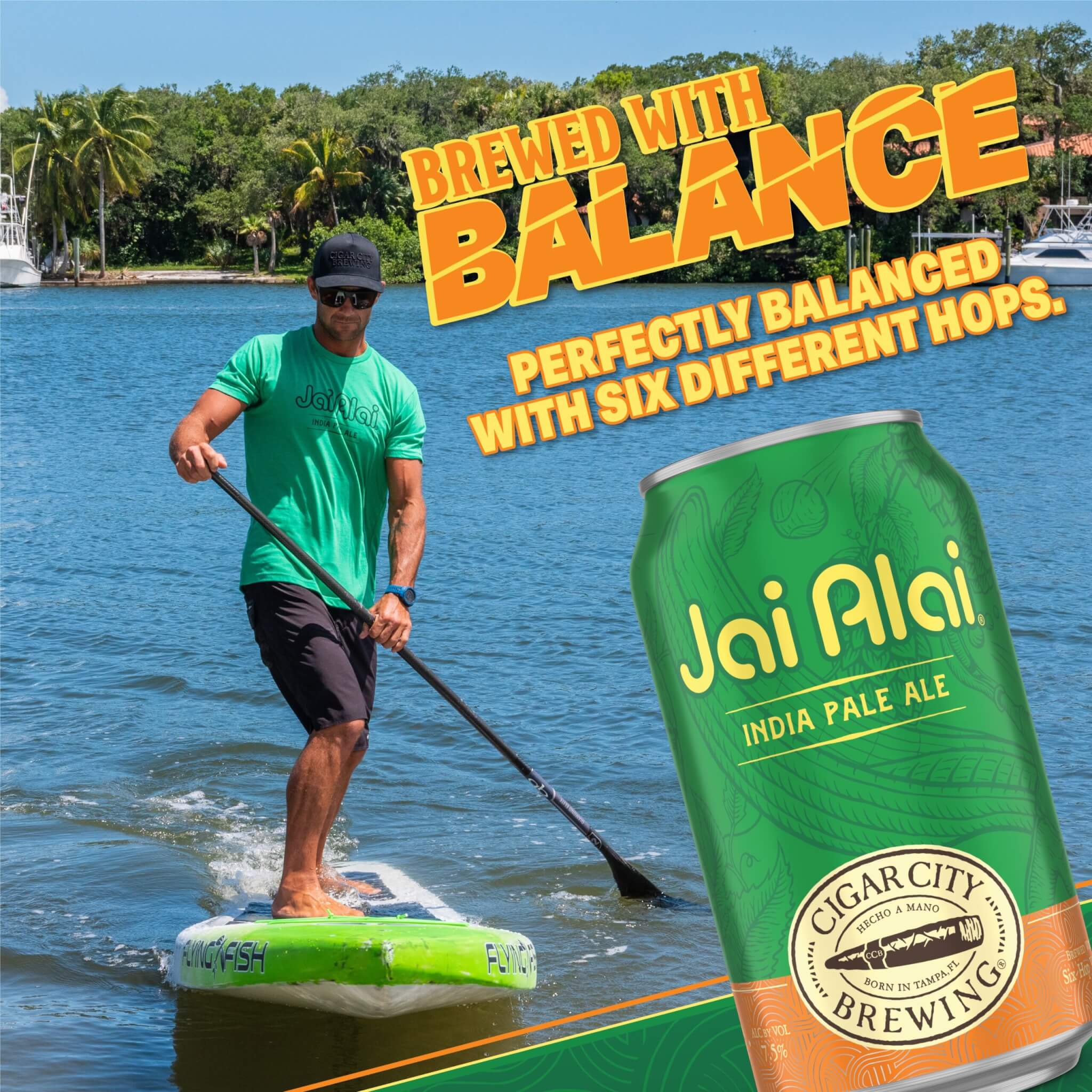 Image of a man standing on a Stand Up Paddleboard next to overlaid text that says Brewed with Balance, perfectly balanced with six different hops and a large can of Jai Alai IPA.